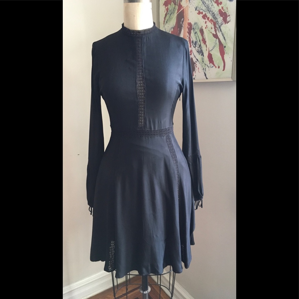 Karl Marx John black dress with lace insets.